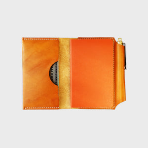 Tan leather wallet white stitching, journal, pen, image